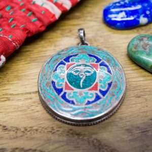 Pendentif yeux de Bouddha sur malachite